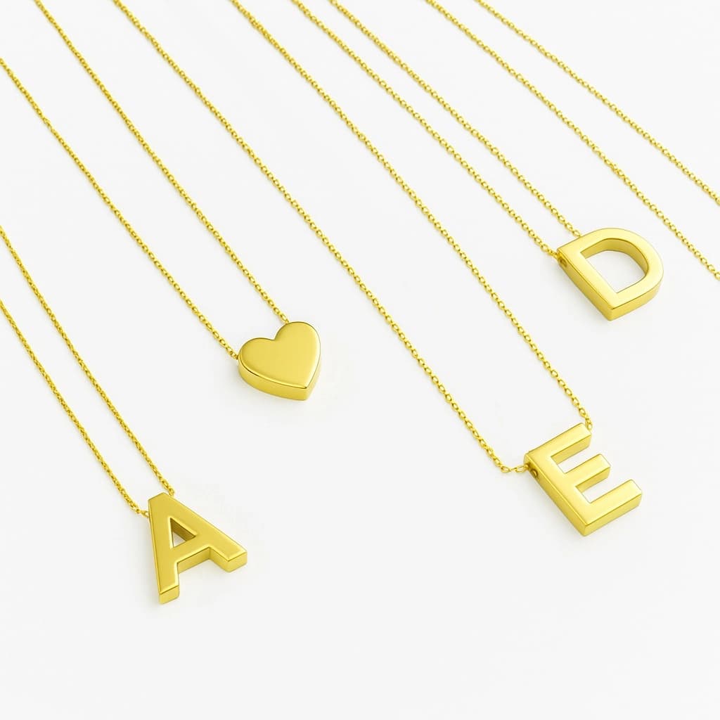 Classic 18k yellow gold initial letter pendant shown on a delicate chain