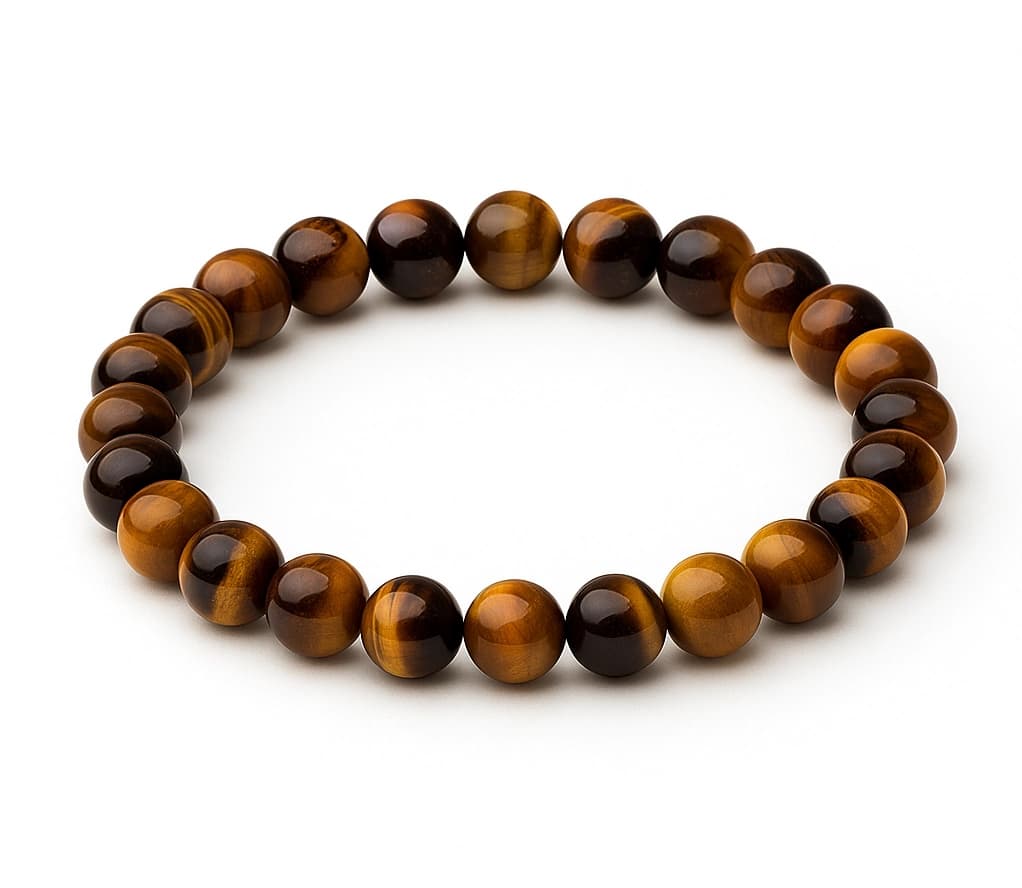 Tiger's eye gemstone bead showing golden chatoyant bands